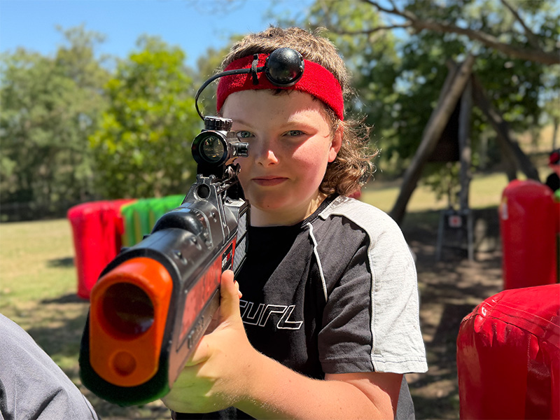 Children playing laser tag at a school fete in NSW